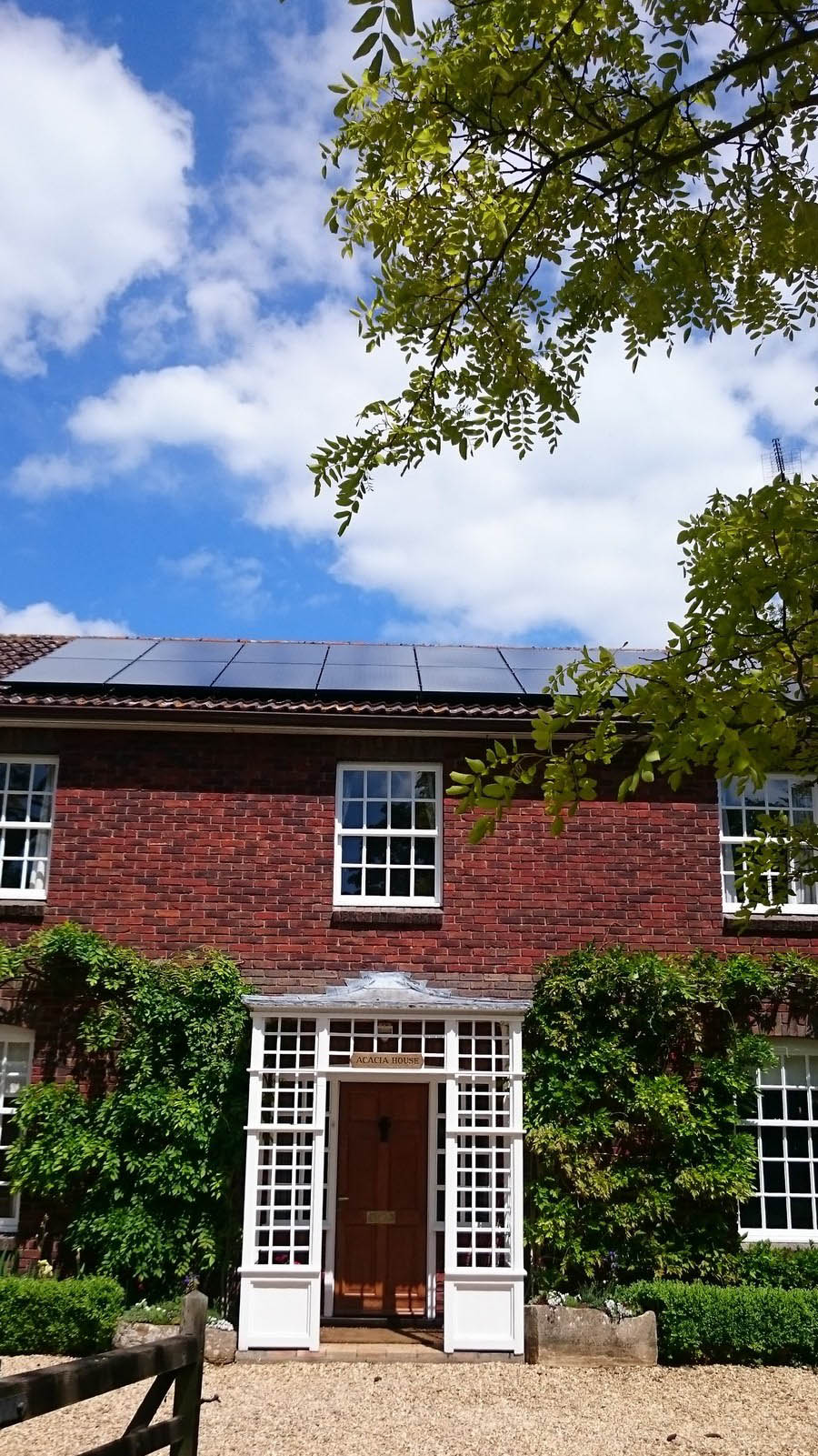 Solar panels on the roof of a large house near Cambridge