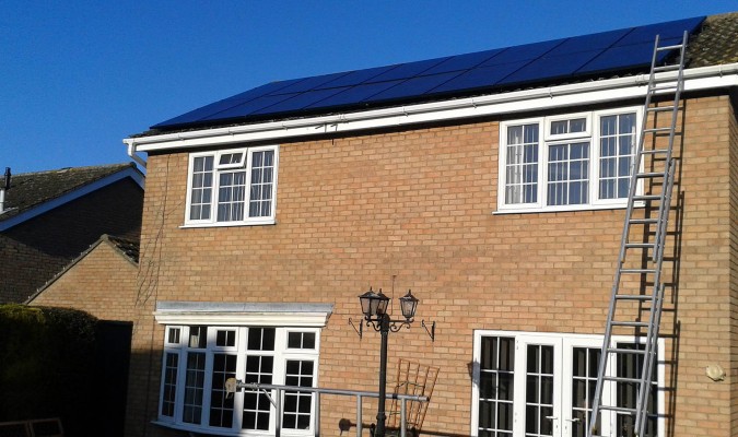 Large numbers of solar panels installed on a house in Cambridge