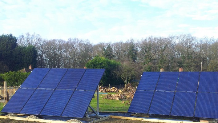 Solar farm near Cambridge producing good amount of electricity on a cloudy spring day