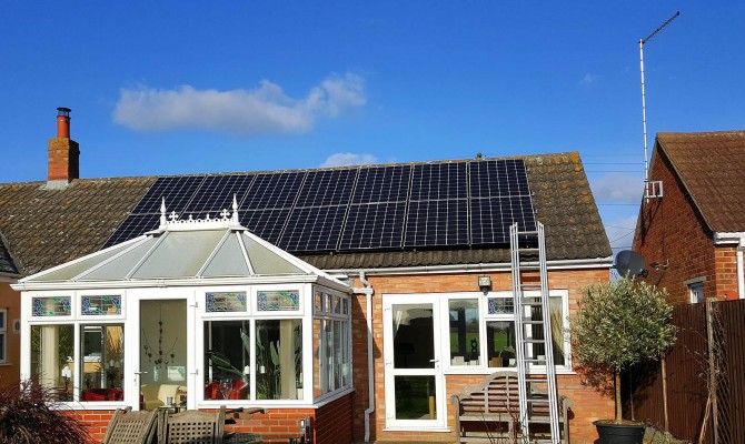 Fourteen solar panels on a medium bungalow house near Cambridge