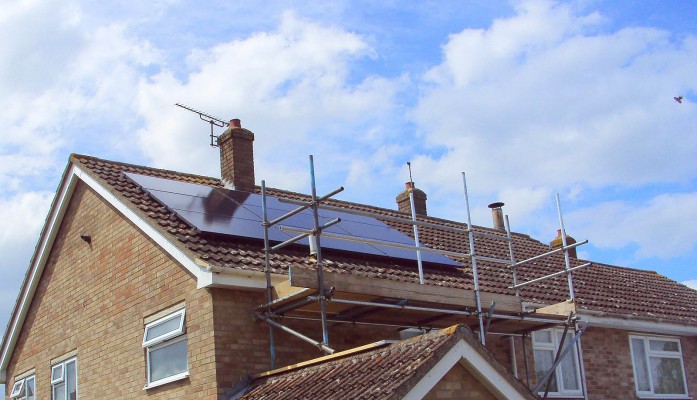 Nine large solar panels producing electricity for a family from Cambridge
