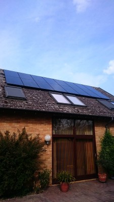 Box gable roof with two rows of solar panels near Cambridge