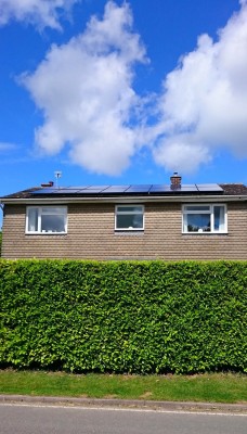 Beautiful summer day and solar panels generating electricity for a family living in a detached house in Cambridgeshire