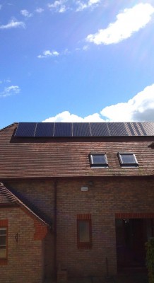 Large house with solar panels generating electricity for a Cambridge-based family